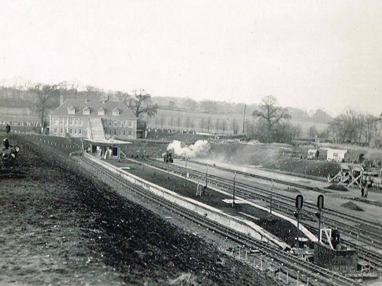 Stanmore station under construction c 1930. Notice Brockley Hill in the background, totally devoid of any kind of housing